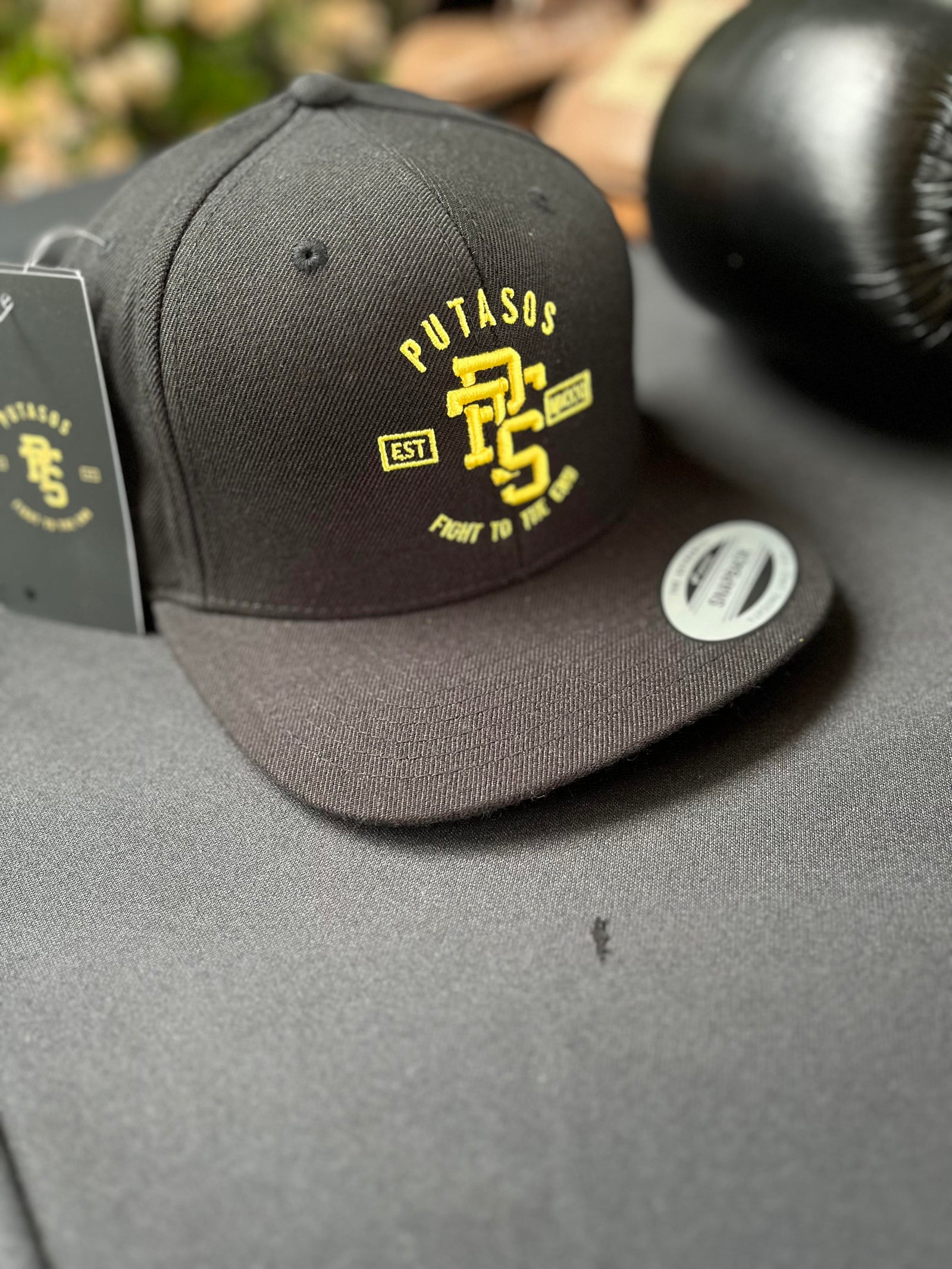 Putasos Original Black Snap Back Hat